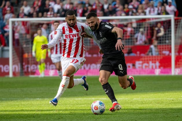 Duel between Linton Maina 1 FC Koeln, 37 and Franck Honorat Borussia Moenchengladbach, 09 1 FC Koeln vs Borussia Moenchengladbach, Football, 1 Bundesliga, 27 Matchday, Season 2025 2026, 21 03 2026 DFL DFB Regulations prohibit any use of Photographs as image sequences and or Quasivideo 1 FC Koeln vs Borussia Moenchengladbach, Football, 1 Bundesliga, 27 Matchday, Season 2025 2026, 21 03 2026 Koeln Copyright: xEibner-Pressefoto ThomasxHaeslerx EP_THR