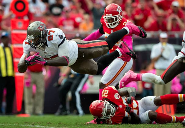 Oct. 14, 2012 - Tampa, FL, USA - Tampa Bay Buccaneers running back LeGarrette Blount (27) leaps over the goal line on his 12-yard touchdown run, past Kansas City Chiefs cornerback Brandon Flowers (24) and Kendrick Lewis (23), in the fourth quarter at Raymond James Stadium in Tampa, Florida, Sunday, October 14, 2012. The Buccaneers defeated the Chiefs, 38-10. Copyright: xDavidxEulittx