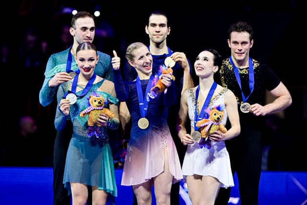 Pairs Awards, L-R, Anastasiia METELKINA & Luka BERULAVA (GEO) second place, Minerva Fabienne HASE & Nikita VOLODIN (GER) first place, Lia PEREIRA & Trennt MICHAUD (CAN) third place, during Victory Ceremony, at the ISU Figure skating, Eiskunstlauf World Championships 2026, at O2 Arena, on March 26, 2026 in Prague, Czechia. Noxthirdxpartyxsales aflo_324980276