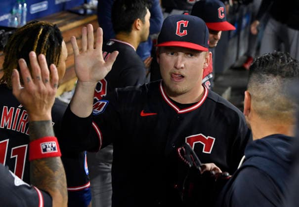 Cleveland Guardians starting pitcher Parker Messick celebrates in the dugout with teamates after pitching six shutout innings against the Los Angeles Dodgers at Dodger Stadium in Los Angeles on Monday, March 30, 2026.  LAP20260330803 JIMxRUYMEN