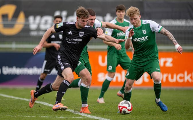 Soccer, Season 2025 2026, Regionalliga West, 11 04 2026, Matchday 29, Men, 1 FC Bocholt black vs SV Roedinghausen green v l Maximilian Adamski 1 FC Bocholt , Viktor Miftaraj SV Roedinghausen , Tim Corsten SV Roedinghausen , Bocholt Stadion am Huenting Nordrhein Westfalen Germany 260411_fb_1fc-bocholt_sv-roedinghausen_50918