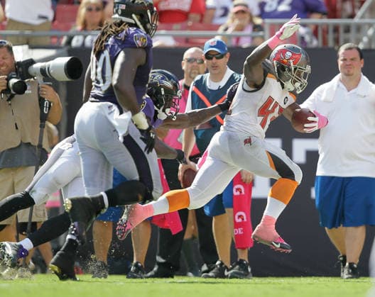 Oct. 12, 2014 - Tampa, FL, USA - Tampa Bay Buccaneers running back Bobby Rainey (43) breaks away for 21 yards during the fourth quarter, setting up a Bucs touchdown against the Baltimore Ravens, on Sunday, Oct. 12, 2014, at Raymond James Stadium in Tampa, Fla. Copyright: xBrendanxFittererx