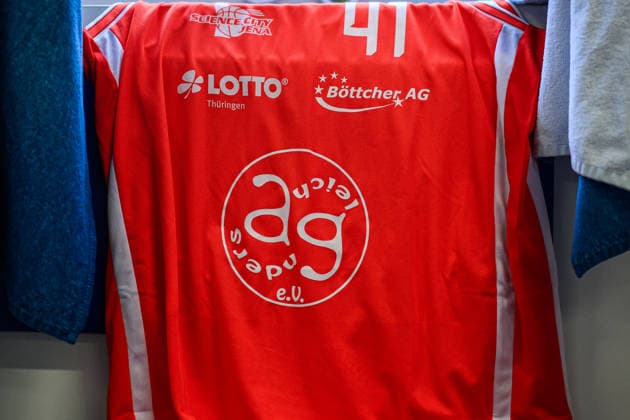 easycredit BBL Basketball Bundesliga 2025 2026 Catch-up match 23 Matchday 14 04 2026 Science City Jena vs Basketball Löwen Braunschweig Science City Jena plays in a special jersey, orange red for the first time, for the Charity Game in favor of Der AndersGleich e V as jersey sponsor Sparkassen Arena