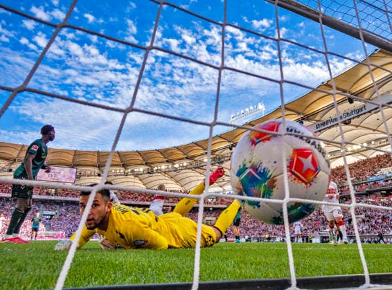 26 04 2026, Soccer 1 Bundesliga 2025 2026, 31 Matchday, VfB Stuttgart SV Werder Bremen, in the MHP Arena Stuttgart, Goalkeeper Mio Backhaus in front, Werder Bremen beaten on the ground after the header goal to equalize 1 1 by Ermedin Demirovic cheering in the back, Stuttgart DFL and DFB regulations prohibit any use of photographs as image sequences and or quasi video