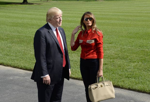 September 10, 2017 - Washington, District of Columbia, United States of America - United States President Donald J. Trump speaks to members of the media about Hurricane Irma as first lady Melania Trump looks on upon their arrival on the South Lawn of the White House in Washington, DC, September 10, 2017, after spending the weekend at Camp David, the Presidential retreat near Thurmont, Maryland. .Credit: Olivier Douliery Pool via CNP Copyright: xOlivierxDoulieryx