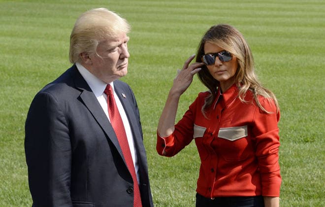 September 10, 2017 - Washington, District of Columbia, United States of America - United States President Donald J. Trump speaks to members of the media about Hurricane Irma as first lady Melania Trump looks on upon their arrival on the South Lawn of the White House in Washington, DC, September 10, 2017, after spending the weekend at Camp David, the Presidential retreat near Thurmont, Maryland. .Credit: Olivier Douliery Pool via CNP Copyright: xOlivierxDoulieryx