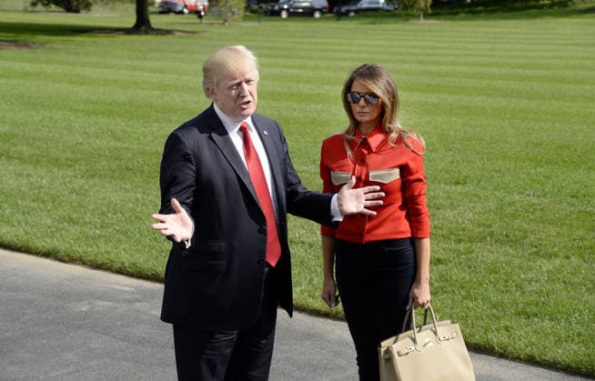 September 10, 2017 - Washington, District of Columbia, United States of America - United States President Donald J. Trump speaks to members of the media about Hurricane Irma as first lady Melania Trump looks on upon their arrival on the South Lawn of the White House in Washington, DC, September 10, 2017, after spending the weekend at Camp David, the Presidential retreat near Thurmont, Maryland. .Credit: Olivier Douliery Pool via CNP Copyright: xOlivierxDoulieryx