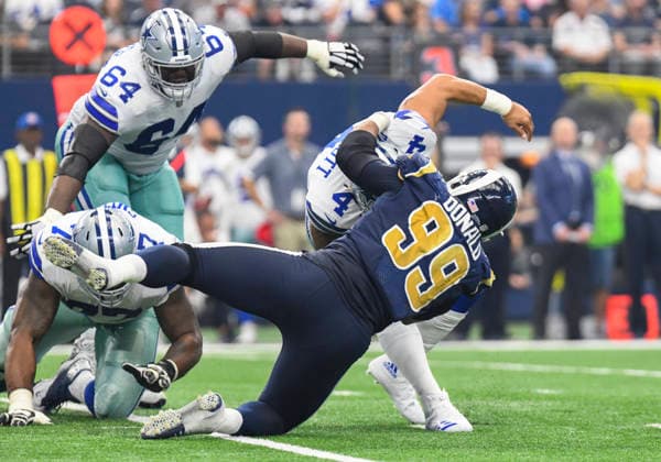 October 01, 2017: Dallas Cowboys quarterback Dak Prescott 4 escapes what would be a sack in the second quarter by Los Angeles Rams defensive tackle Caushaud Lyons 99 during an NFL, American Football Herren, USA football game between the Los Angeles Rams and the Dallas Cowboys at AT&T Stadium in Arlington, TX Dallas leads at the half 24-16 Albert Pena CSM Copyright: xAlbertxPenax