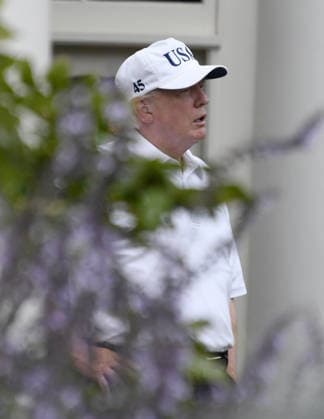 October 14, 2017 - Washington, District of Columbia, United States of America - United States President Donald J. Trump in the First Lady s garden of the White House in Washington, DC following a round of golf with US Senator Lindsey Graham (Republican of South Carolina) on Saturday, October 14, 2017..Credit: Ron Sachs Pool via CNP Copyright: xRonxSachs CNPx