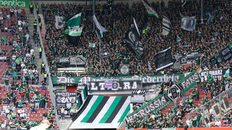 Fans of Team Borussia Mönchengladbach at the match between FC Augsburg v Borussia Mönchengladbach, Soccer, Men, Bundesliga, 2025 2026, 33 Matchday on 09 05 2026 in Augsburg, WWK ARENA DFL and DFB regulations prohibit any use of photographs as image sequences and or quasi video Bayern Germany