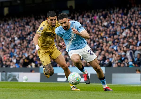 Manchester, England, 13th May 2026. Rayan Alt-Nouri of Manchester City gets past Daniel Munoz of Crystal Palace during the Manchester City vs Crystal Palace Premier League match at the Etihad Stadium, Manchester. Picture credit should read: Andrew Yates Sportimage EDITORIAL USE ONLY. No use with unauthorised audio, video, data, fixture lists, club league logos or live services. Online in-match use limited to 120 images, no video emulation. No use in betting, games or single club league player publications. SPI_019_AY_Man_City_Palace SPI-4799-0019