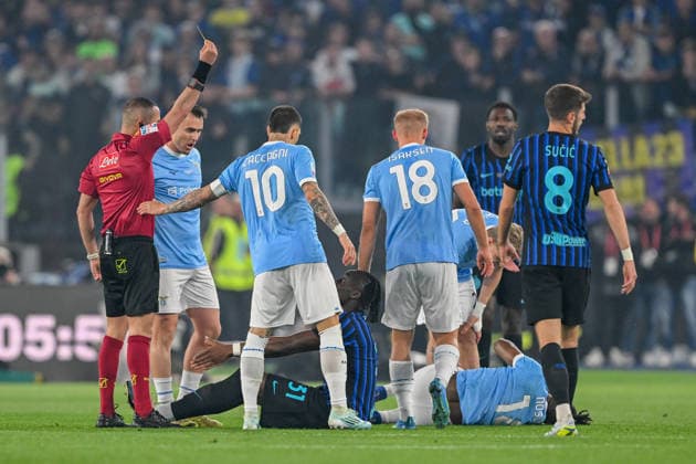 the referee gives a yellow card to InterÕs Yann-Aurel Bisseck during the Frecciarossa Italian Cup 2025 2026 final soccer match between Lazio and Inter Milan at the Stadio Olimpico in Rome, Italy - May 13, 2026 - Soccer  Copyright: xTanoxPecoraro LaPressex