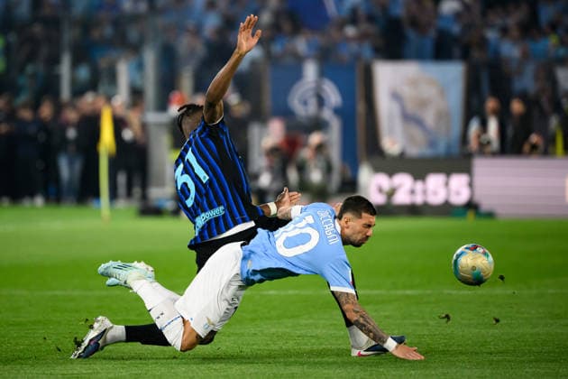 Yann Bisseck of FC Internazionale and Mattia Zaccagni of SS Lazio compete for the ball during the 2025 2026 Coppa Italia football final between SS Lazio and FC Internazionale at Stadio Olimpico in Rome (Italy), May 13, 2026. AndreaxStaccioli