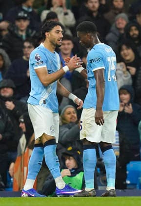 Manchester, England, 13th May 2026. Omar Marmoush of Manchester City celebrates scoring their second goal with Marc Guehi of Manchester City (r) during the Manchester City vs Crystal Palace Premier League match at the Etihad Stadium, Manchester. Picture credit should read: Andrew Yates Sportimage EDITORIAL USE ONLY. No use with unauthorised audio, video, data, fixture lists, club league logos or live services. Online in-match use limited to 120 images, no video emulation. No use in betting, games or single club league player publications. SPI_041_AY_Man_City_Palace SPI-4799-0040