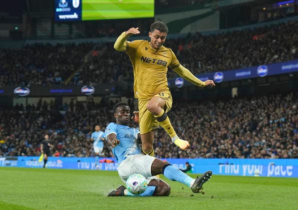 Manchester, England, 13th May 2026. Marc Guehi of Manchester City tackles Brennan Johnson of Crystal Palace during the Manchester City vs Crystal Palace Premier League match at the Etihad Stadium, Manchester. Picture credit should read: Andrew Yates Sportimage EDITORIAL USE ONLY. No use with unauthorised audio, video, data, fixture lists, club league logos or live services. Online in-match use limited to 120 images, no video emulation. No use in betting, games or single club league player publications. SPI_053_AY_Man_City_Palace SPI-4799-0051