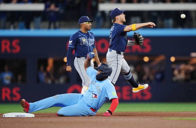 May 13, 2026, Toronto, On, CANADA: Tampa Bay Rays shortstop Taylor Walls (right) forces out Toronto Blue Jays Vladimir Guerrero Jr. (27) at second base and throws to first to complete the double play during fourth inning MLB, Baseball Herren, USA baseball action in Toronto on Wednesday, May 13, 2026. Canada News - May 13, 2026  - ZUMAc35_ 20260513_zaf_c35_158 Copyright: xNathanxDenettex