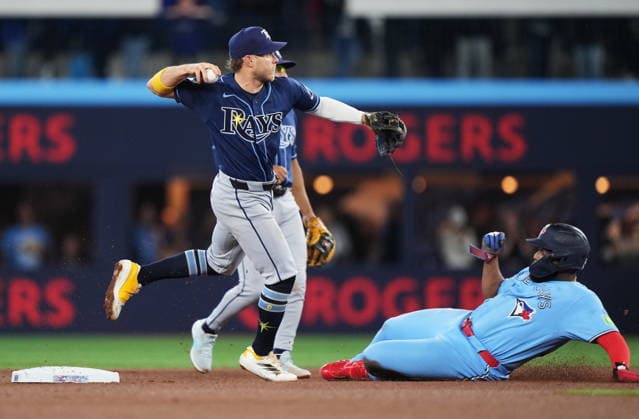 May 13, 2026, Toronto, On, CANADA: Tampa Bay Rays shortstop Taylor Walls (left) forces out Toronto Blue Jays Vladimir Guerrero Jr. (27) at second base and throws to first to complete the double play during fourth inning MLB, Baseball Herren, USA baseball action in Toronto on Wednesday, May 13, 2026. Canada News - May 13, 2026  - ZUMAc35_ 20260513_zaf_c35_159 Copyright: xNathanxDenettex