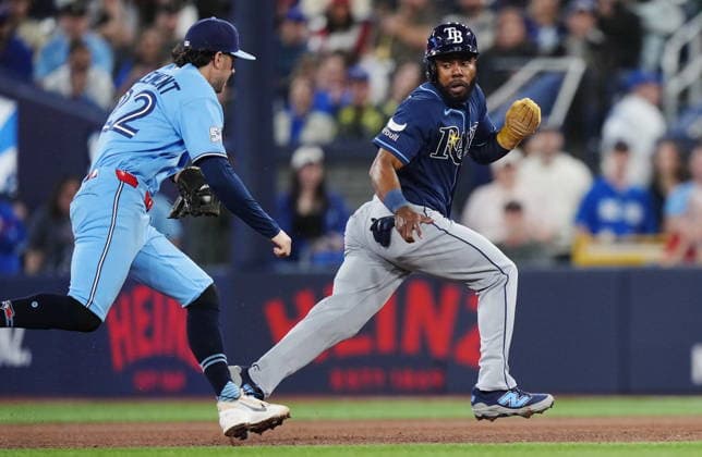 May 13, 2026, Toronto, On, CANADA: Toronto Blue Jays second baseman Ernie Clement (left) chases down Tampa Bay Rays Cedric Mullins (31) and tags him out trying to steal second base during fifth inning MLB, Baseball Herren, USA baseball action in Toronto on Wednesday, May 13, 2026. Canada News - May 13, 2026  - ZUMAc35_ 20260513_zaf_c35_161 Copyright: xNathanxDenettex