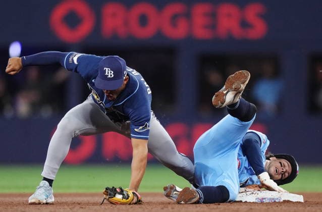 May 13, 2026, Toronto, On, CANADA: Tampa Bay Rays second baseman Richie Palacios (left) forces out Toronto Blue Jays Ernie Clement (22) at second base on a double play during seventh inning MLB, Baseball Herren, USA baseball action in Toronto on Wednesday, May 13, 2026. Canada News - May 13, 2026  - ZUMAc35_ 20260513_zaf_c35_175 Copyright: xNathanxDenettex