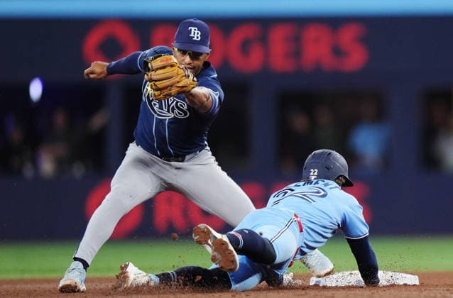 May 13, 2026, Toronto, On, CANADA: Tampa Bay Rays second baseman Richie Palacios (left) forces out Toronto Blue Jays Ernie Clement (22) at second base on a double play during seventh inning MLB, Baseball Herren, USA baseball action in Toronto on Wednesday, May 13, 2026. Canada News - May 13, 2026  - ZUMAc35_ 20260513_zaf_c35_176 Copyright: xNathanxDenettex