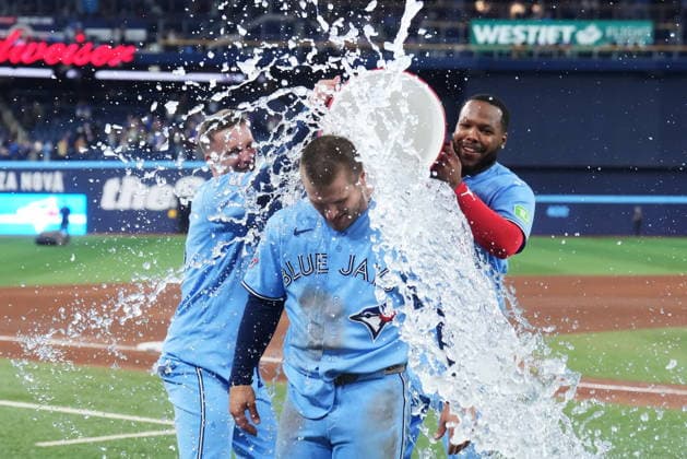 May 13, 2026, Toronto, On, CANADA: Toronto Blue Jays Daulton Varsho is doused by Myles Straw (left) and Vladimir Guerrero Jr. after hitting a walk-off grand slam against the Tampa Bay Rays during 10th inning MLB, Baseball Herren, USA baseball action in Toronto on Wednesday, May 13, 2026. Canada News - May 13, 2026  - ZUMAc35_ 20260513_zaf_c35_203 Copyright: xNathanxDenettex