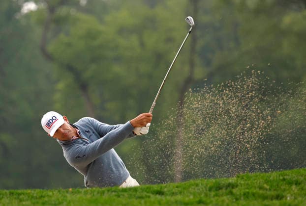 Billy Horschel chips out of a bunker on the 10th hole during the first round of the 2026 PGA, Golf Herren Championship at Aronimink Golf Club in Newtown Square, Pennsylvania, on Thursday, May 14, 2026.  PHI20260514802 LAURENCExKESTERSON