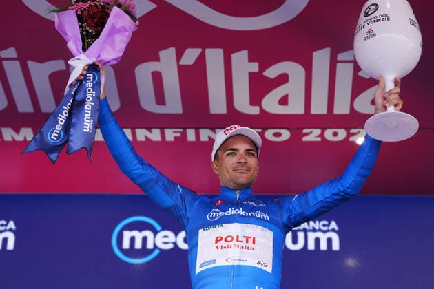 The blue jersey Spain™s Diego Pablo Sevilla Lopez of Team Polti VisitMalta celebrate on the podium after the Stage 6 of the Giro d™Italia, from Paestum to Naples, Italy, Thursday, May 14, 2026.  Copyright: xMassimoxPaolone LaPressex