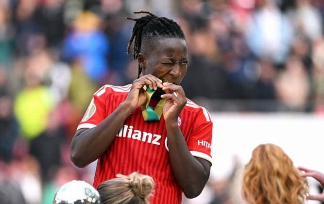 Football, Germany, Women, Season 2025 2026, DFB Cup Final, Rhein Energie Stadium Cologne, VfL Wolfsburg FC Bayern Munich 0 4 Bernadette Amani FCB tests the medal Cheers, joy, action