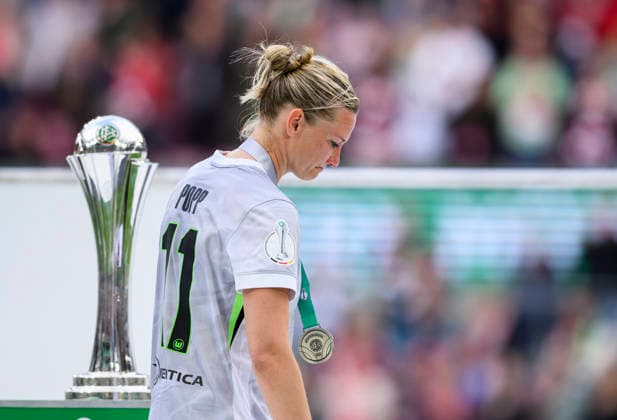 Award ceremony, Alexandra POPP WOB passes DFB, Frustration DFB Pokal der Frauen Finale 2026, VfL Wolfsburg WOB FC Bayern Muenchen M , am 14 05 2026 in Koeln Germany DFB regulations prohibit any use of photographs as image sequences and or quasi video Â