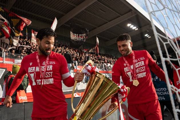 THUN, BERN - MAY 14: Marco Bürki and Leonardo Bertone of FC Thun pose with the championship trophy after the match following the Brack Super League match between FC Thun and BSC Young Boys at Visana Arena on May 14, 2026 in Thun, Bern, Switzerland. Copyright: xLivioxBaeriswylx xSPPx Sportspressphoto_SPR146282
