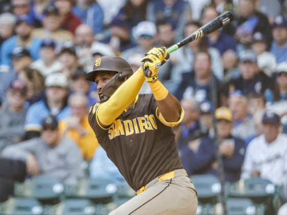 San Diego Padres designated hitter Miguel Andujar hits a double in the first inning of the MLB, Baseball Herren, USA game between the San Diego Padres and the Milwaukee Brewers at American Family Field in Milwaukee, Wisconsin on Thursday, May 14, 2026.  MIL20260514805 TANNENxMAURY