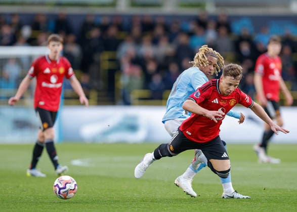 Manchester, England, 14th May 2026. Tyrone Samba of Manchester City tackles Amir Ibragimov of Manchester United, ManU during the Manchester City U18 vs Manchester United U18 FA Youth Cup Final match at the Academy Stadium, Manchester. Picture credit should read: Cody Froggatt Sportimage EDITORIAL USE ONLY. No use with unauthorised audio, video, data, fixture lists, club league logos or live services. Online in-match use limited to 120 images, no video emulation. No use in betting, games or single club league player publications. SPI_021_CF_MANCHESTER_CITY_U18_V_MANCHESTER_UNITED_U18 SPI-4801-0019