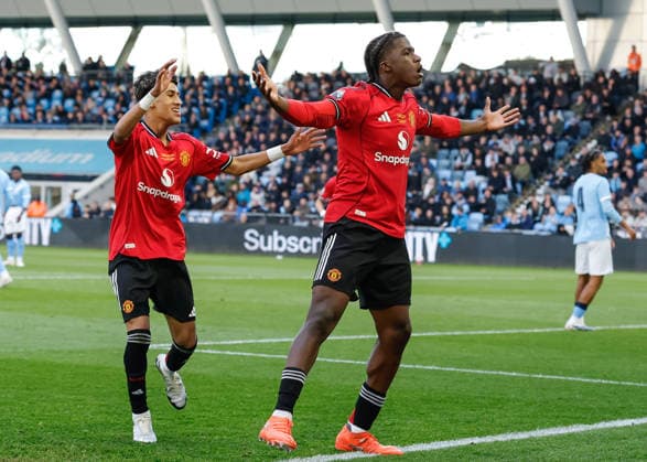 Manchester, England, 14th May 2026. Godwill Kukonki of Manchester United, ManU celebrates scoring their sides first goal during the Manchester City U18 vs Manchester United U18 FA Youth Cup Final match at the Academy Stadium, Manchester. Picture credit should read: Cody Froggatt Sportimage EDITORIAL USE ONLY. No use with unauthorised audio, video, data, fixture lists, club league logos or live services. Online in-match use limited to 120 images, no video emulation. No use in betting, games or single club league player publications. SPI_025_CF_MANCHESTER_CITY_U18_V_MANCHESTER_UNITED_U18 SPI-4801-0023