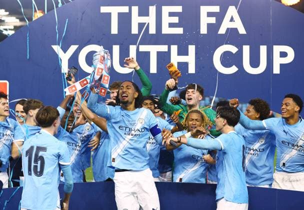 Manchester City lift the FA Youth Cup trophy at the end of the match Manchester City U18 v Manchester United, ManU U18, FA Youth Cup Final, Football, Joie Stadium, Manchester , UK - 14 May 2026Manchester Joie Stadium United Kingdom EDITORIAL USE ONLY No use with unauthorised audio, video, data, fixture lists, club league logos or live services. Online in-match use limited to 120 images, no video emulation. No use in betting, games or single club league player publications.  Copyright: xMattxWest Shutterstockx 16871363aj