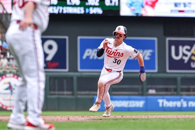 May 14, 2026, Minneapolis, Minnesota, USA: Minnesota Twins left fielder JAMES OUTMAN (30) rounds third base to score on a RBI single hit by Minnesota Twins right fielder AUSTIN MARTIN (16) during a MLB, Baseball Herren, USA Baseball game between the Miami Marlins and the Minnesota Twins at Target Field in Minneapolis, Minnesota on May 14th, 2026. ZUMA Press Wire. Minneapolis USA - ZUMAg254 20260514_zsp_g254_077 Copyright: xStevenxGarciax