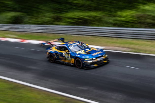 The Ford Mustang GT3 with starting number 64 from the HRT Ford Racing team with drivers Dennis Olsen, Christopher Mies, Frederic Vervisch and Arjun Maini drives during Qualifying 1 on the Nordschleife of the Nürburgring Nürburg Rhineland-Palatinate Germany