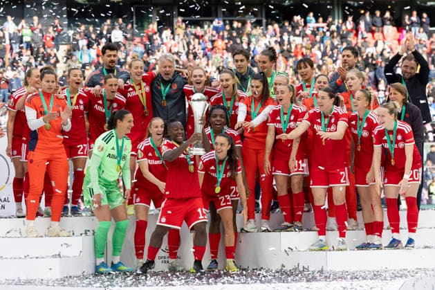 Bernadette AMANI M 15 has the trophy in her hands, the team celebrates with, joy, jubilation, laughter DFB Pokal der Frauen Finale 2026, VfL Wolfsburg WOB FC Bayern Muenchen M , final score 0 4, am 14 05 2026 in Koeln Germany DFB regulations prohibit any use of photographs as image sequences and or quasi video Â