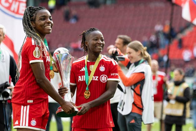 Edna IMADE M 29, left and Bernadette AMANI M 15, right with the trophy in their hands Joy, laughter DFB Pokal der Frauen Finale 2026, VfL Wolfsburg WOB FC Bayern Muenchen M , final score 0 4, am 14 05 2026 in Koeln Germany DFB regulations prohibit any use of photographs as image sequences and or quasi video Â