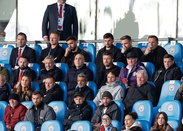 Manchester, England, 14th May 2026. Top row left to right, Jonny Evans first team coach, Bruno Fernandes, Mason Mount and Luke Shaw of Manchester United, ManU Below left to ritght, Jason Wilcox director of football, Omar Berrada chief executive officer, Michael Carrick interim head coach, Steve Holland assistant coach and Jonathan Woodgate first team coach of Manchester United are seen in the stands during the Manchester City U18 vs Manchester United U18 FA Youth Cup Final match at the Academy Stadium, Manchester. Picture credit should read: Cody Froggatt Sportimage EDITORIAL USE ONLY. No use with unauthorised audio, video, data, fixture lists, club league logos or live services. Online in-match use limited to 120 images, no video emulation. No use in betting, games or single club league player publications. SPI_054_CF_MANCHESTER_CITY_U18_V_MANCHESTER_UNITED_U18 SPI-4801-0052