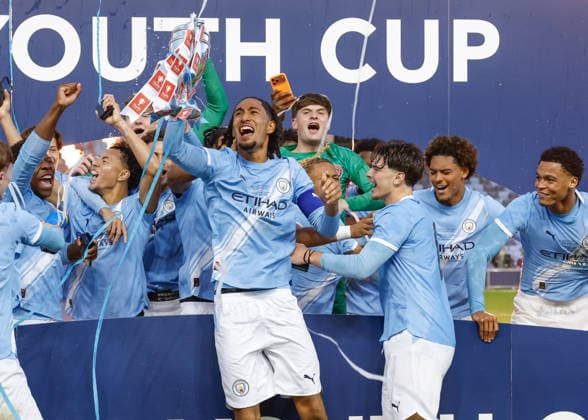 Manchester, England, 14th May 2026. Kaden Braithwaite of Manchester City lifts the FA Youth Cup after the team s victory following the Manchester City U18 vs Manchester United, ManU U18 FA Youth Cup Final match at the Academy Stadium, Manchester. Picture credit should read: Cody Froggatt Sportimage EDITORIAL USE ONLY. No use with unauthorised audio, video, data, fixture lists, club league logos or live services. Online in-match use limited to 120 images, no video emulation. No use in betting, games or single club league player publications. SPI_066_CF_MANCHESTER_CITY_U18_V_MANCHESTER_UNITED_U18 SPI-4801-0064
