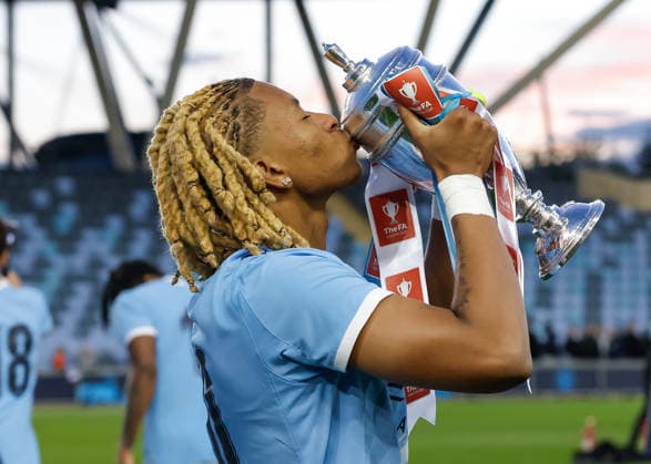 Manchester, England, 14th May 2026. Tyrone Samba of Manchester City kisses the FA Youth Cup trophy as he celebrates following the Manchester City U18 vs Manchester United, ManU U18 FA Youth Cup Final match at the Academy Stadium, Manchester. Picture credit should read: Cody Froggatt Sportimage EDITORIAL USE ONLY. No use with unauthorised audio, video, data, fixture lists, club league logos or live services. Online in-match use limited to 120 images, no video emulation. No use in betting, games or single club league player publications. SPI_075_CF_MANCHESTER_CITY_U18_V_MANCHESTER_UNITED_U18 SPI-4801-0073