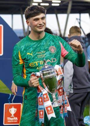 Manchester, England, 14th May 2026. Max Hudson of Manchester City celebrates with the FA Youth Cup trophy following the Manchester City U18 vs Manchester United, ManU U18 FA Youth Cup Final match at the Academy Stadium, Manchester. Picture credit should read: Cody Froggatt Sportimage EDITORIAL USE ONLY. No use with unauthorised audio, video, data, fixture lists, club league logos or live services. Online in-match use limited to 120 images, no video emulation. No use in betting, games or single club league player publications. SPI_083_CF_MANCHESTER_CITY_U18_V_MANCHESTER_UNITED_U18 SPI-4801-0081