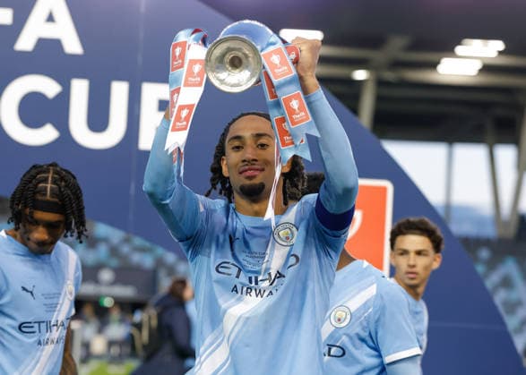 Manchester, England, 14th May 2026. Kaden Braithwaite of Manchester City celebrates with the FA Youth Cup trophy following the Manchester City U18 vs Manchester United, ManU U18 FA Youth Cup Final match at the Academy Stadium, Manchester. Picture credit should read: Cody Froggatt Sportimage EDITORIAL USE ONLY. No use with unauthorised audio, video, data, fixture lists, club league logos or live services. Online in-match use limited to 120 images, no video emulation. No use in betting, games or single club league player publications. SPI_085_CF_MANCHESTER_CITY_U18_V_MANCHESTER_UNITED_U18 SPI-4801-0083