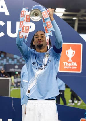 Manchester, England, 14th May 2026. Kaden Braithwaite of Manchester City celebrates with the FA Youth Cup trophy following the Manchester City U18 vs Manchester United, ManU U18 FA Youth Cup Final match at the Academy Stadium, Manchester. Picture credit should read: Cody Froggatt Sportimage EDITORIAL USE ONLY. No use with unauthorised audio, video, data, fixture lists, club league logos or live services. Online in-match use limited to 120 images, no video emulation. No use in betting, games or single club league player publications. SPI_086_CF_MANCHESTER_CITY_U18_V_MANCHESTER_UNITED_U18 SPI-4801-0084