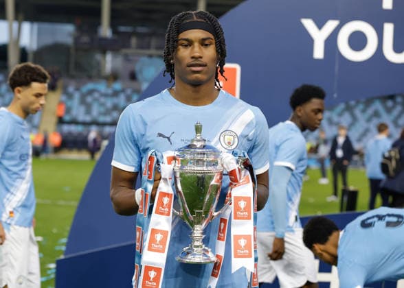 Manchester, England, 14th May 2026. Reigan Heskey of Manchester City celebrates with the FA Youth Cup trophy following the Manchester City U18 vs Manchester United, ManU U18 FA Youth Cup Final match at the Academy Stadium, Manchester. Picture credit should read: Cody Froggatt Sportimage EDITORIAL USE ONLY. No use with unauthorised audio, video, data, fixture lists, club league logos or live services. Online in-match use limited to 120 images, no video emulation. No use in betting, games or single club league player publications. SPI_089_CF_MANCHESTER_CITY_U18_V_MANCHESTER_UNITED_U18 SPI-4801-0087