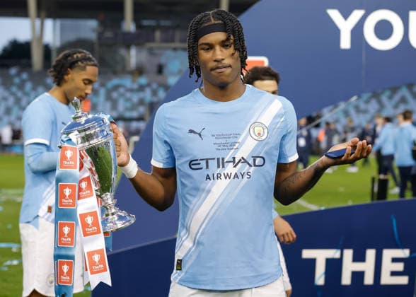 Manchester, England, 14th May 2026. Reigan Heskey of Manchester City celebrates with the FA Youth Cup trophy following the Manchester City U18 vs Manchester United, ManU U18 FA Youth Cup Final match at the Academy Stadium, Manchester. Picture credit should read: Cody Froggatt Sportimage EDITORIAL USE ONLY. No use with unauthorised audio, video, data, fixture lists, club league logos or live services. Online in-match use limited to 120 images, no video emulation. No use in betting, games or single club league player publications. SPI_090_CF_MANCHESTER_CITY_U18_V_MANCHESTER_UNITED_U18 SPI-4801-0088