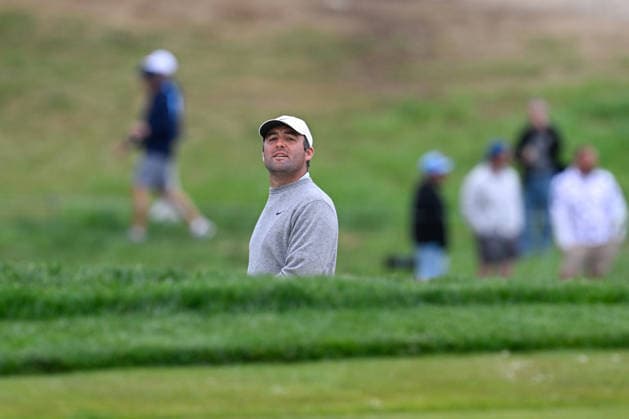 NEWTON SQUARE, PA - MAY 14: Scottie Scheffler of United States of America peeks out from a bunker during round one of the 2026 PGA, Golf Herren Championship on May 14th, 2026 at Aronimink Golf Club in Newtown Square, PA.(Photo by Terence Lewis Icon Sportswire) GOLF: MAY 14 PGA PGA Championship EDITORIAL USE ONLY Icon260514042