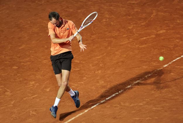 (260515) -- ROME, May 15, 2026 -- Daniil Medvedev of Russia hits a return during the men s singles quarterfinal match between Martin Landaluce of Spain and Daniil Medvedev of Russia at the ATP, Tennis Herren Italian Open in Rome, Italy, May 14, 2026. ) (SP)ITALY-ROME-TENNIS-ATP-MARTIN LANDALUCE VS DANIIL MEDVEDEV LixJing 