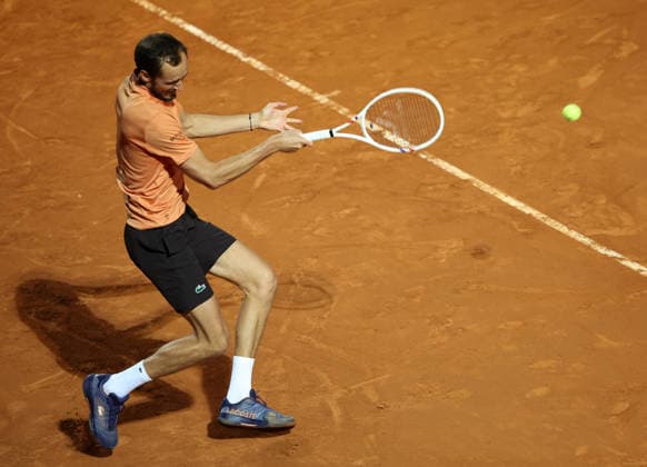 (260515) -- ROME, May 15, 2026 -- Daniil Medvedev of Russia hits a return during the men s singles quarterfinal match between Martin Landaluce of Spain and Daniil Medvedev of Russia at the ATP, Tennis Herren Italian Open in Rome, Italy, May 14, 2026. ) (SP)ITALY-ROME-TENNIS-ATP-MARTIN LANDALUCE VS DANIIL MEDVEDEV LixJing 