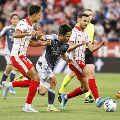 Football: Spanish La Liga Real Sociedad s Takefusa Kubo (C) vies for the ball in a Spanish La Liga football match against Girona on May 14, 2026, in Girona, Spain.  A14AA0005559929P
